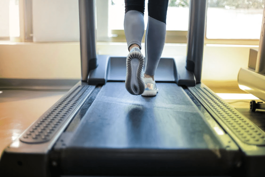 The 12-3-30 Workout: A Game-Changer for Beginners Trying to Lose Weight - Stefi PT Free Close-up shot of a person exercising on a treadmill, showcasing fitness and health focus. Stock Photo used as example of 12-3-30